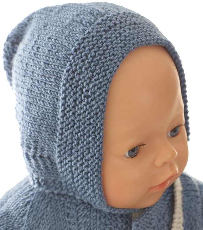 A lovely bonnet with the same little pattern as knitted for the coat is knitted along each side.