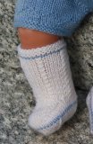 Lovely doll knitting pattern to your Baby born