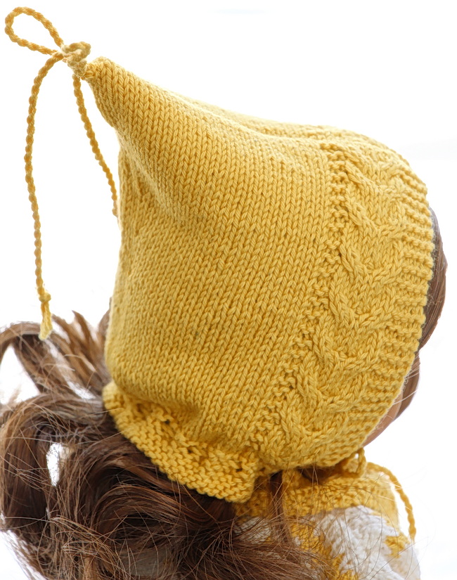 The bonnet, with its yellow hue and edge plaits, brings back memories of childhood winters.