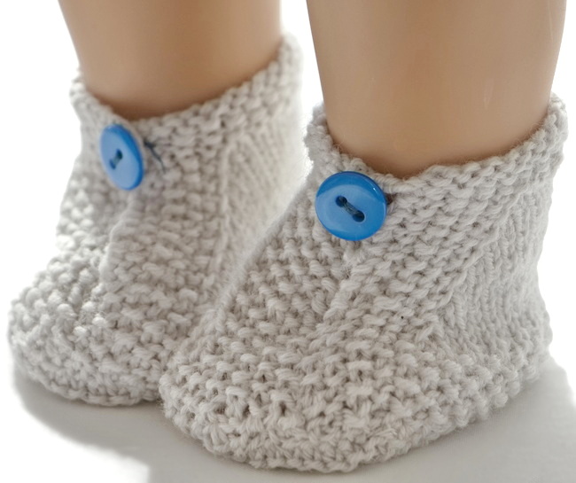 At last, your doll will get a pair of lovely grey shoes buttoned with a small blue button.
