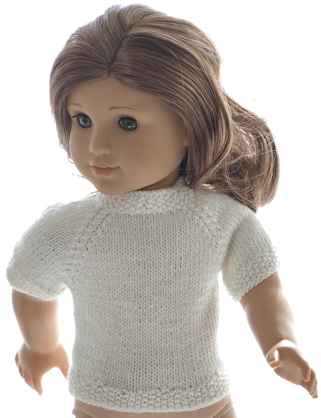 The white short-sleeved sweater is knitted in stocking sts with nice edges in moss sts
