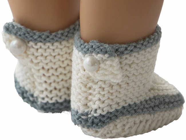 Elegant and adorable, these knitted shoes with pearl button accents complete the classic, sophisticated look.