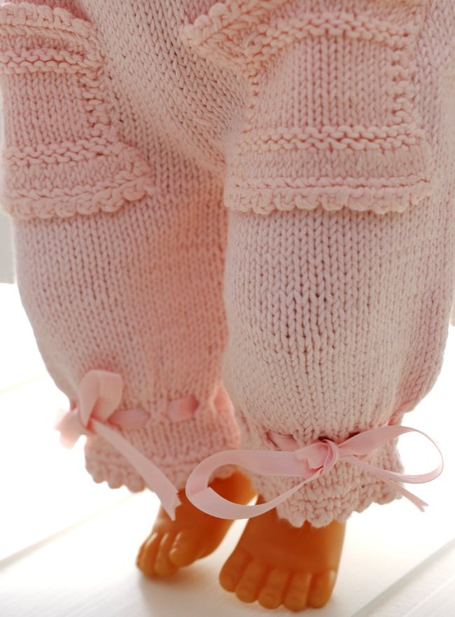 The choice of pink, complemented by intricate crochet details, ...